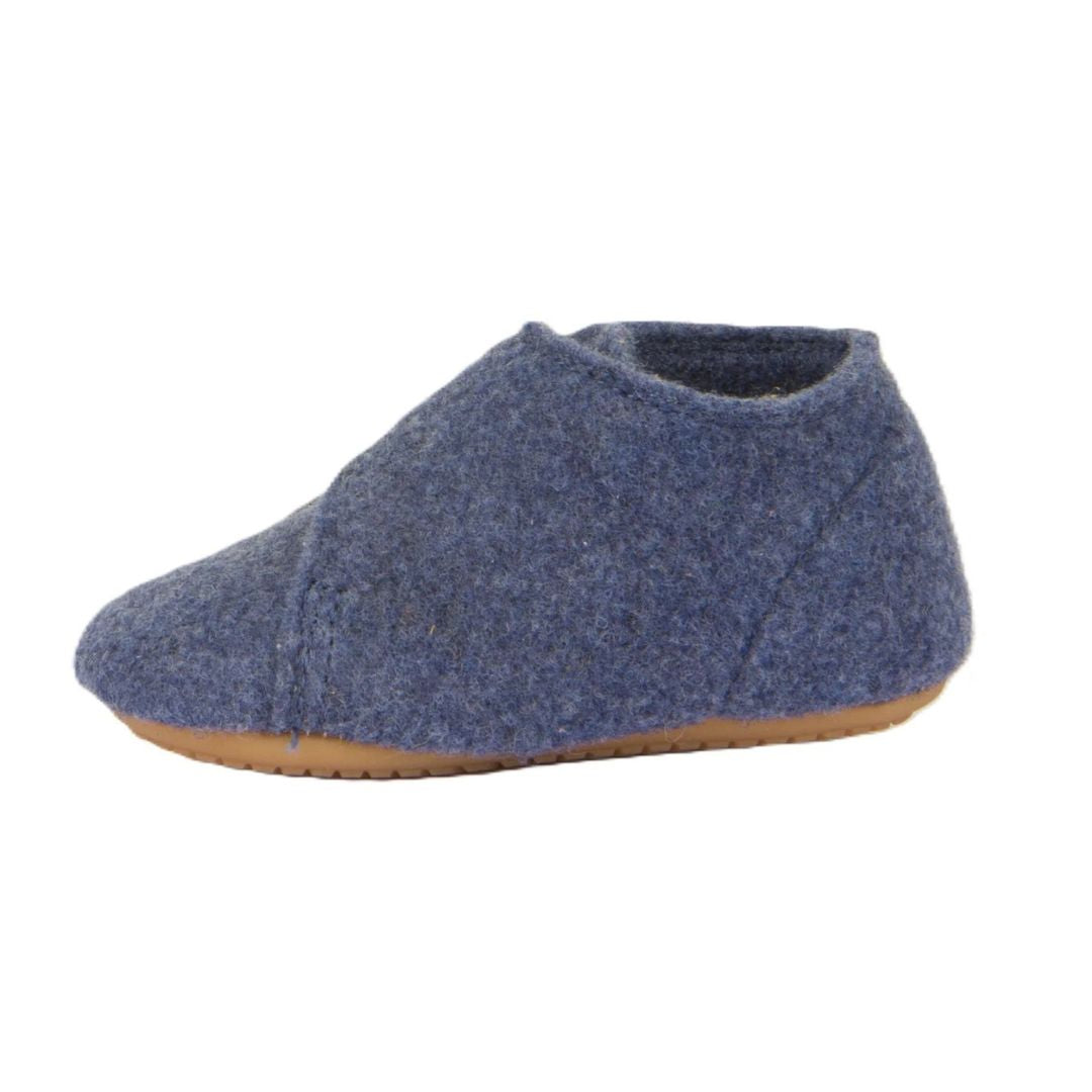 Chausson bébé Froddo en laine bleu foncé, avec une semelle souple antidérapante et un velcro pour un bon ajustement.
