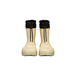 Botte d'hiver Fubuki pour les enfants, dans la couleur beige avec une sangle noire au-dessus pour ajuster la largeur au mollet.