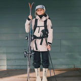 Botte d'hiver montante Fubuki pour adultes, dans la couleur beige avec une sangle noire au-dessus pour ajuster la largeur au mollet.