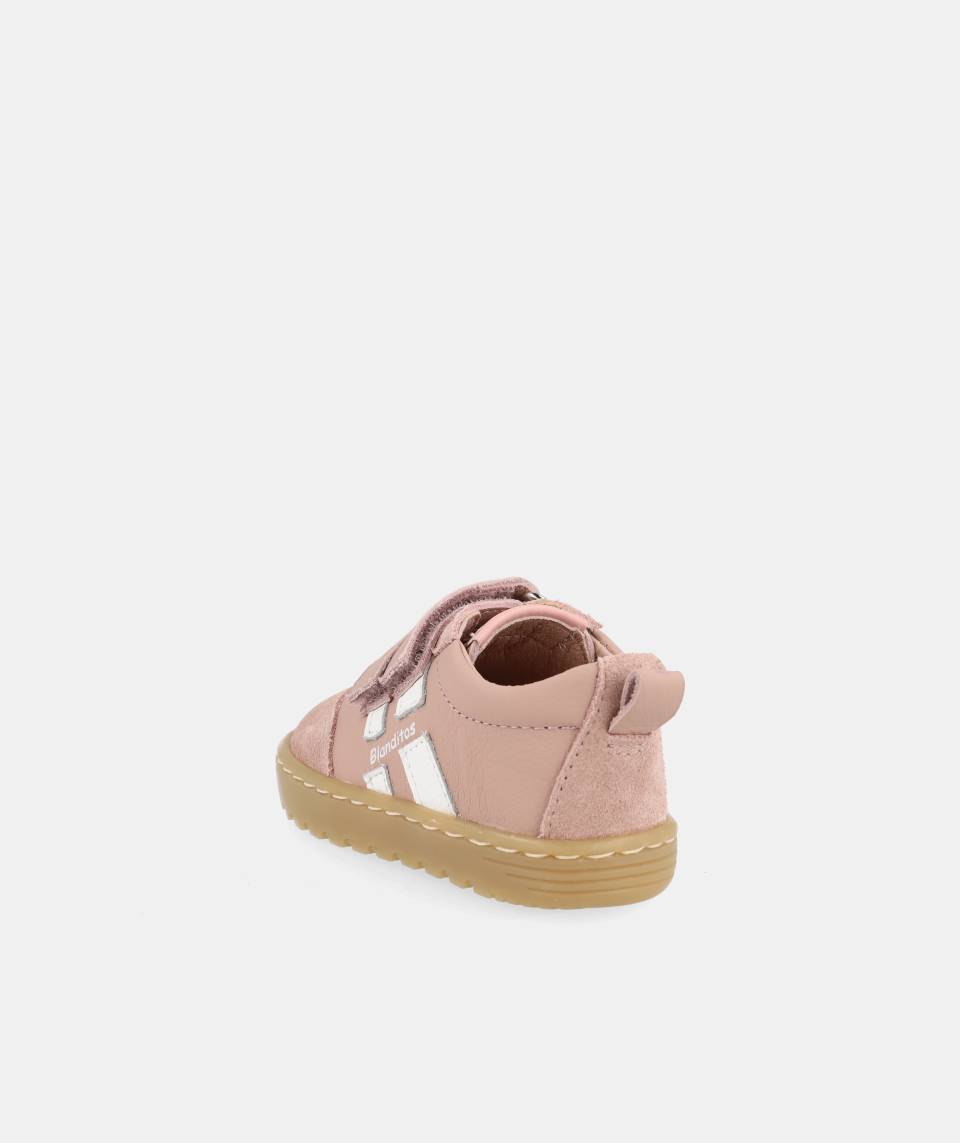 chaussure rose avec bandes blanches, inscription Blanditos sur le côté et semelle épaisse brune