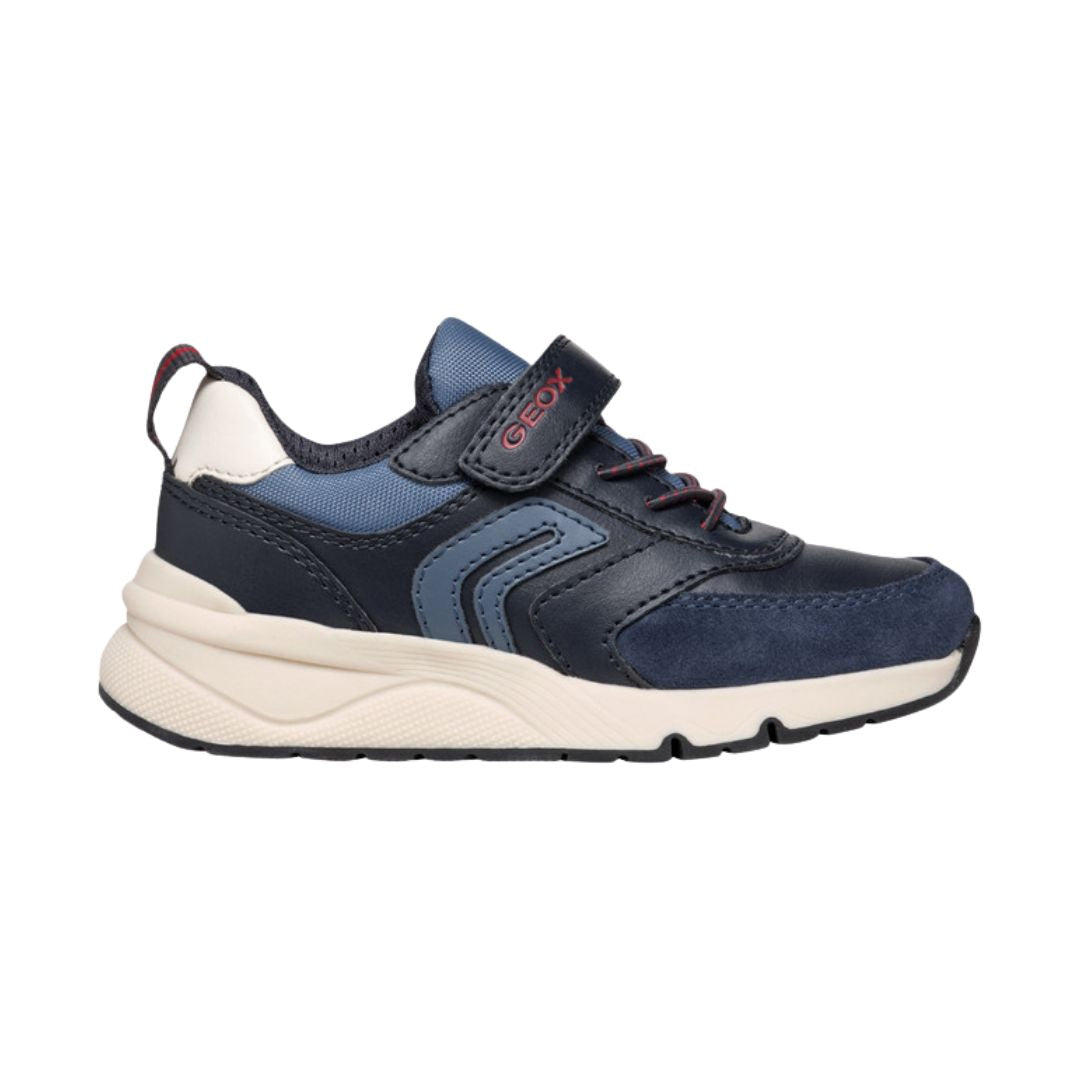 chaussure enfant bicolore noir et bleu, en bi-matière avec semelle blanche et fermeture à velcro.
