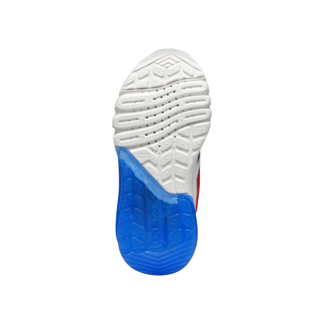 Semelle antidérapante bleue et blanche d'une chaussure de sport Geox pour enfant