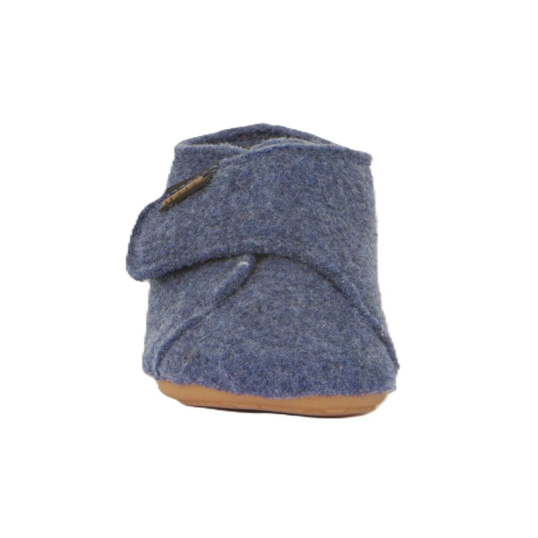 Chausson bébé Froddo en laine bleu foncé, avec une semelle souple antidérapante et un velcro pour un bon ajustement.